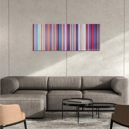 Sing color palette canvas on a concrete wall above a gray sectional sofa