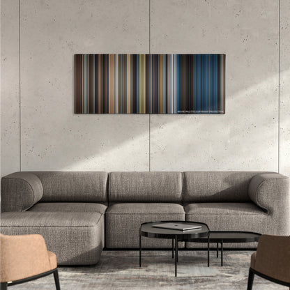 The Equalizer 2 color palette canvas on a concrete wall above a gray sectional sofa