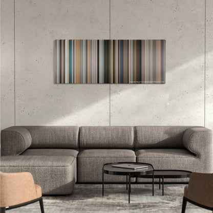 Fun with Dick and Jane color palette canvas on a concrete wall above a gray sectional sofa