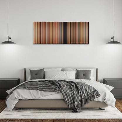 This Is 40 color palette canvas above a bed, between two black pendant lamps