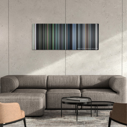 Come and See color palette canvas on a concrete wall above a gray sectional sofa