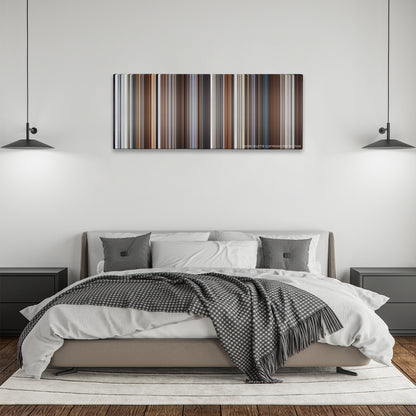 Joy color palette canvas above a bed, between two black pendant lamps