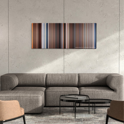 Splash color palette canvas on a concrete wall above a gray sectional sofa