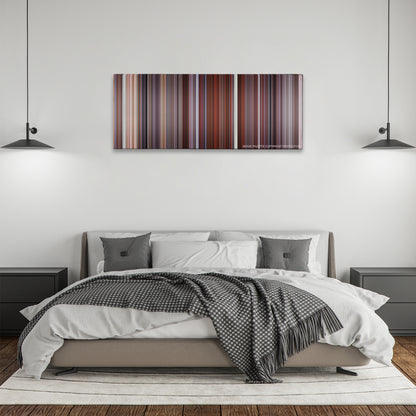 Along Came Polly color palette canvas above a bed, between two black pendant lamps