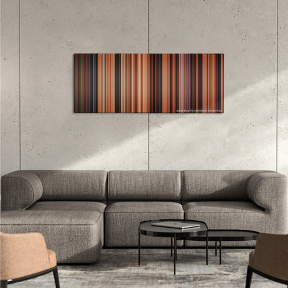 Ratatouille color palette canvas on a concrete wall above a gray sectional sofa