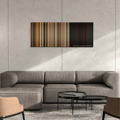 The Texas Chainsaw Massacre: The Beginning color palette canvas on a concrete wall above a gray sectional sofa