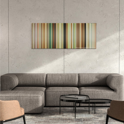 Austenland color palette canvas on a concrete wall above a gray sectional sofa