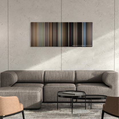 The Bridges of Madison County color palette canvas on a concrete wall above a gray sectional sofa