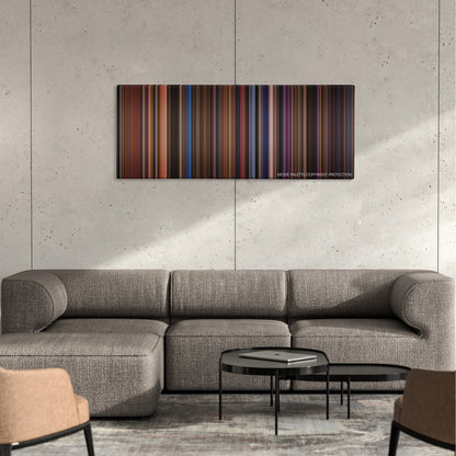 Rock of Ages color palette canvas on a concrete wall above a gray sectional sofa