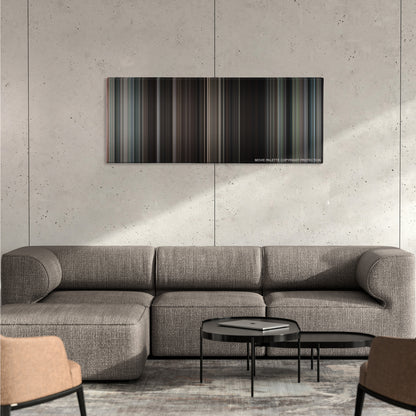 The Great Escape color palette canvas on a concrete wall above a gray sectional sofa