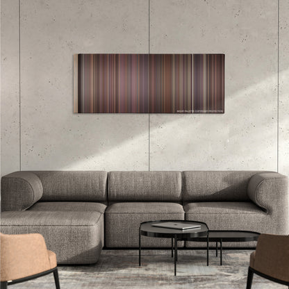 Rope color palette canvas on a concrete wall above a gray sectional sofa