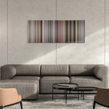 A Simple Favor color palette canvas on a concrete wall above a gray sectional sofa