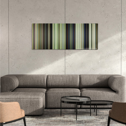 We Were Soldiers color palette canvas on a concrete wall above a gray sectional sofa