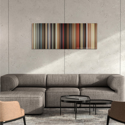 Harold & Kumar Escape from Guantanamo Bay color palette canvas on a concrete wall above a gray sectional sofa