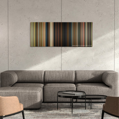 Odd Thomas color palette canvas on a concrete wall above a gray sectional sofa