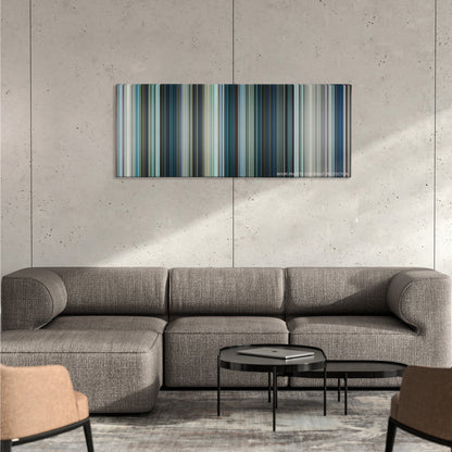 Chappie color palette canvas on a concrete wall above a gray sectional sofa