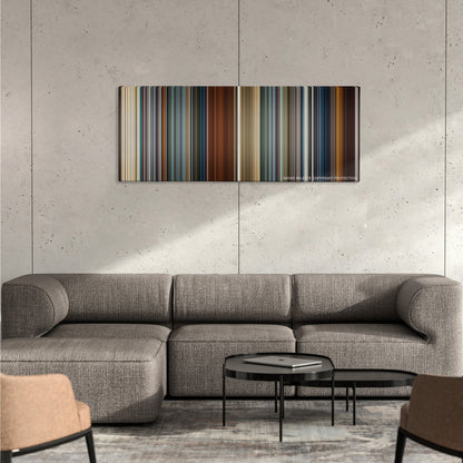 Skyfall color palette canvas on a concrete wall above a gray sectional sofa