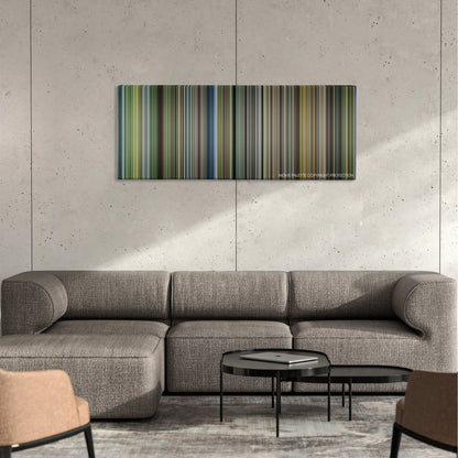 The New World color palette canvas on a concrete wall above a gray sectional sofa