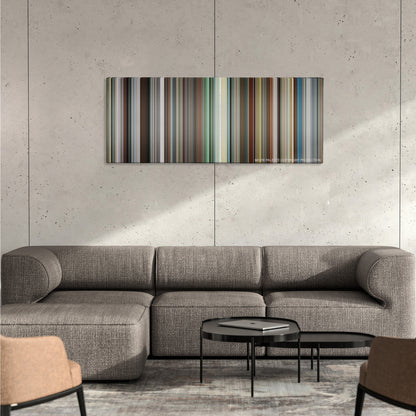 The Other Woman color palette canvas on a concrete wall above a gray sectional sofa