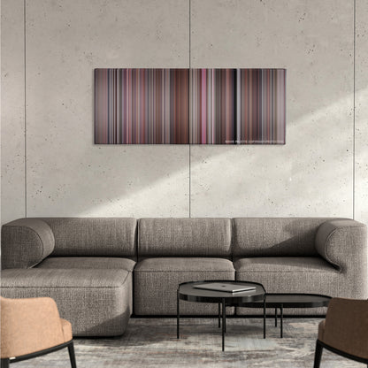 A Fish Called Wanda color palette canvas on a concrete wall above a gray sectional sofa