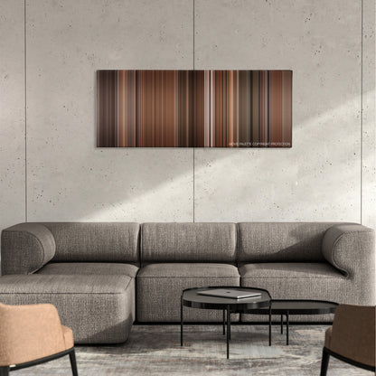 Before Sunset color palette canvas on a concrete wall above a gray sectional sofa