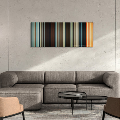 Macbeth color palette canvas on a concrete wall above a gray sectional sofa
