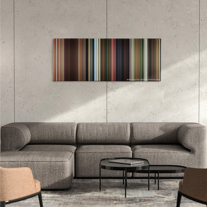 Madagascar color palette canvas on a concrete wall above a gray sectional sofa