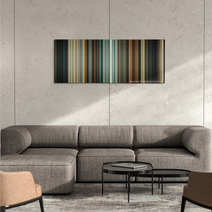 Drive color palette canvas on a concrete wall above a gray sectional sofa