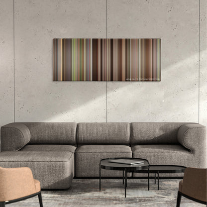 A League of Their Own color palette canvas on a concrete wall above a gray sectional sofa