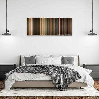 The Muppets color palette canvas above a bed, between two black pendant lamps