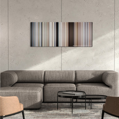 The Road Warrior color palette canvas on a concrete wall above a gray sectional sofa