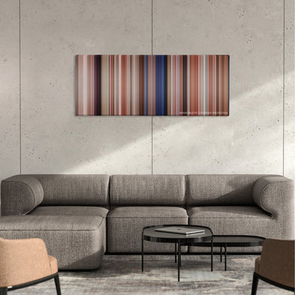 Pretty in Pink color palette canvas on a concrete wall above a gray sectional sofa
