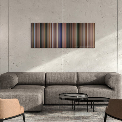 Coach Carter color palette canvas on a concrete wall above a gray sectional sofa