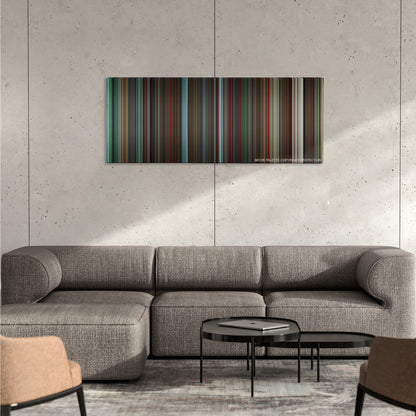 Ex Machina color palette canvas on a concrete wall above a gray sectional sofa