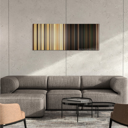 Green Zone color palette canvas on a concrete wall above a gray sectional sofa