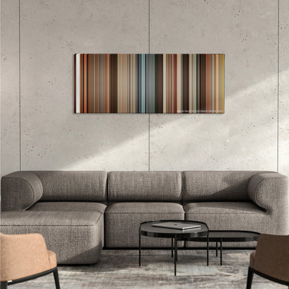 Juno color palette canvas on a concrete wall above a gray sectional sofa
