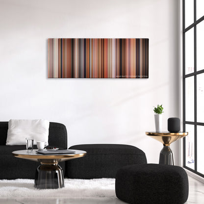 Volver color palette canvas above a black sofa with a gold-topped table