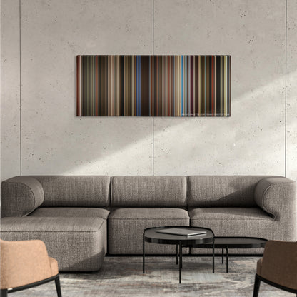 Rocketman color palette canvas on a concrete wall above a gray sectional sofa