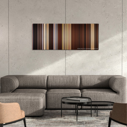 Django Unchained color palette canvas on a concrete wall above a gray sectional sofa