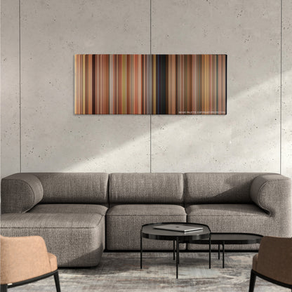 This Is 40 color palette canvas on a concrete wall above a gray sectional sofa