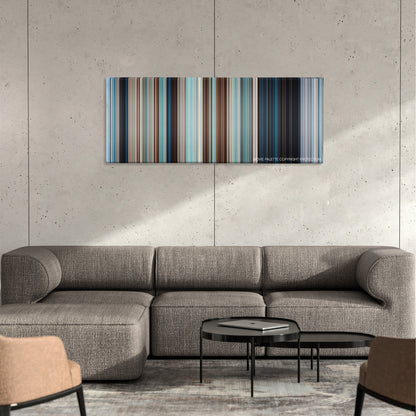 Free Willy color palette canvas on a concrete wall above a gray sectional sofa