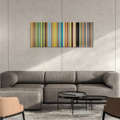 Primer color palette canvas on a concrete wall above a gray sectional sofa