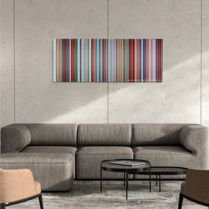 Despicable Me color palette canvas on a concrete wall above a gray sectional sofa