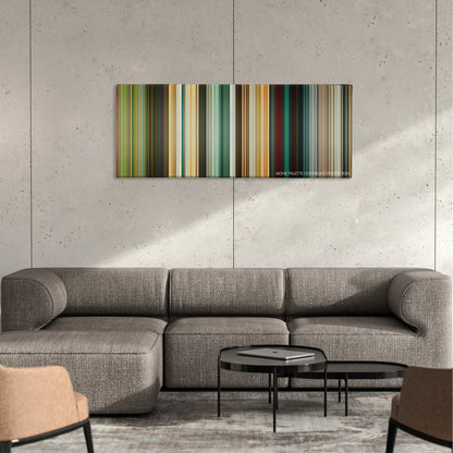 The Losers color palette canvas on a concrete wall above a gray sectional sofa