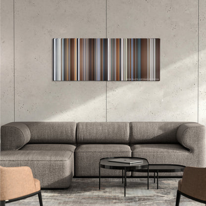 Joy color palette canvas on a concrete wall above a gray sectional sofa