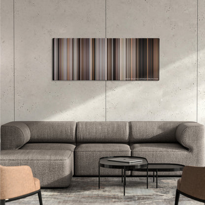 A Bronx Tale color palette canvas on a concrete wall above a gray sectional sofa
