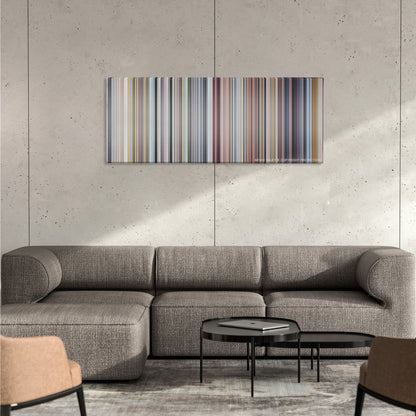 Love Actually color palette canvas on a concrete wall above a gray sectional sofa