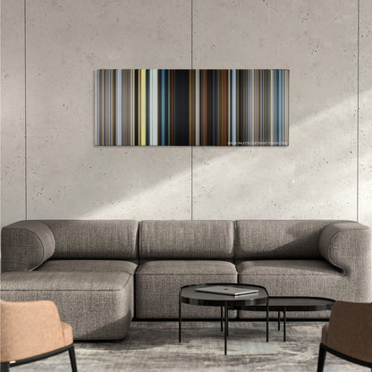 The Dark Tower color palette canvas on a concrete wall above a gray sectional sofa