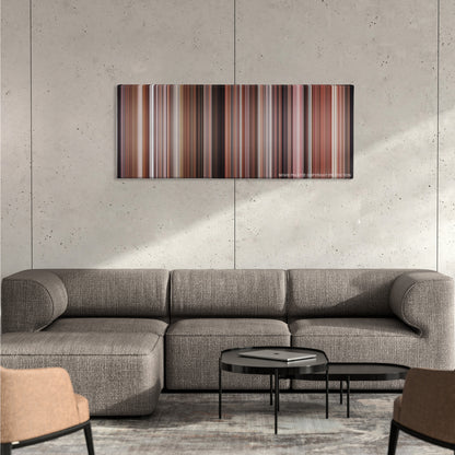 A Christmas Story color palette canvas on a concrete wall above a gray sectional sofa