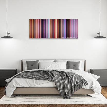 Speed Racer color palette canvas above a bed, between two black pendant lamps